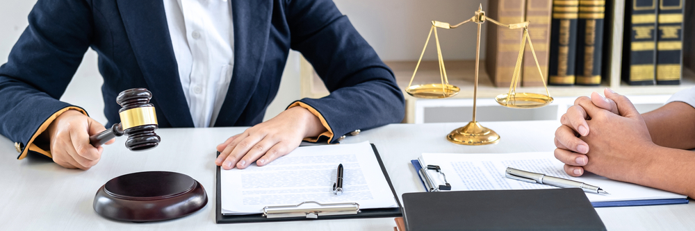 Consultation and conference of female lawyers and professional businesswoman working and discussion having at law firm in office. Concepts of law, Judge gavel with scales of justice.