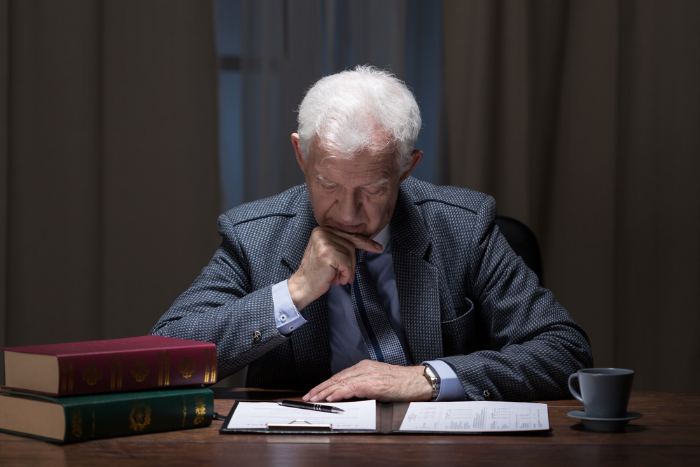 Senior lawyer working overtime in law firm